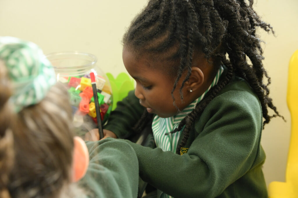 Prep School Early Years pupil writing