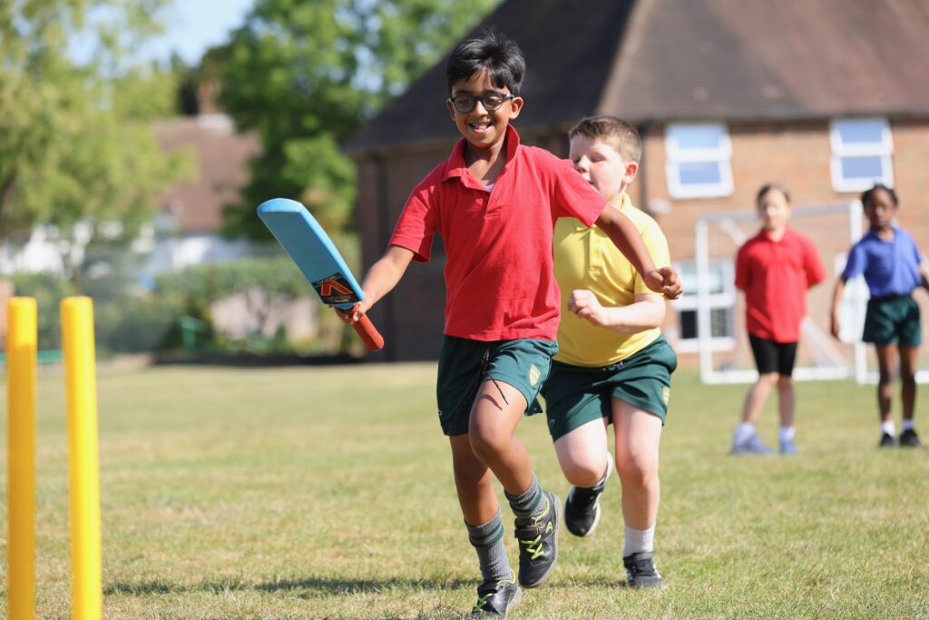 Prep pupils playing cricket