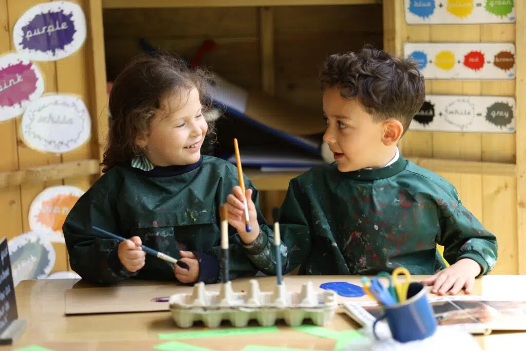 Early Years pupils painting