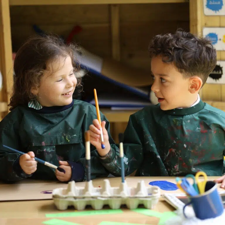 Early Years pupils painting