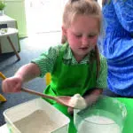 Early Years pupil baking