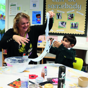 Early Years pupil making slime