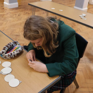 Senior pupil designing a Christmas decoration 2