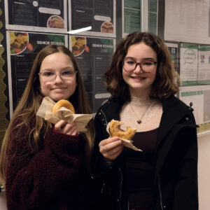 Senior School pupils eating doughnuts