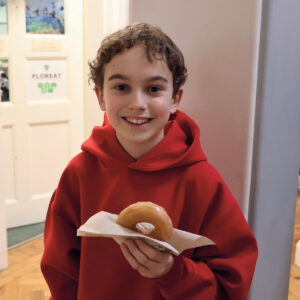 Senior School pupils eating doughnuts