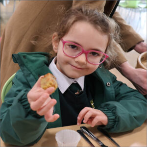 Prep School pupil eating vegetables