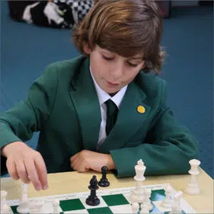 Pupil playing chess