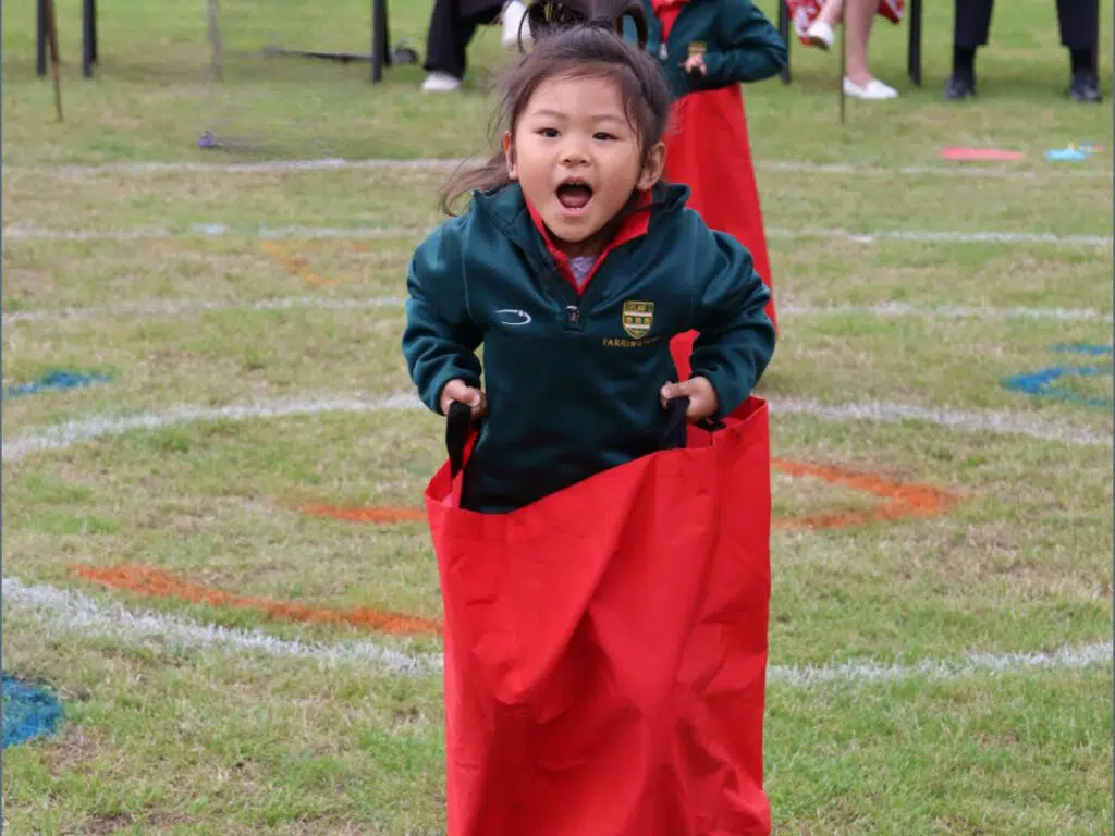 Pre-Reception pupil in the sack race