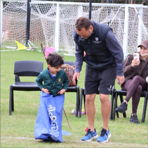 Pre-Reception pupil in the sack race