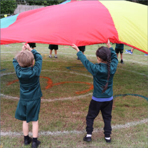 Pre-Reception pupil in the sack race